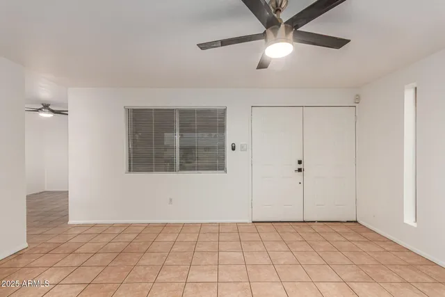 a kitchen with a sink and a refrigerator