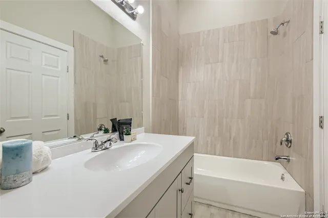 a bathroom with a sink and a bathtub