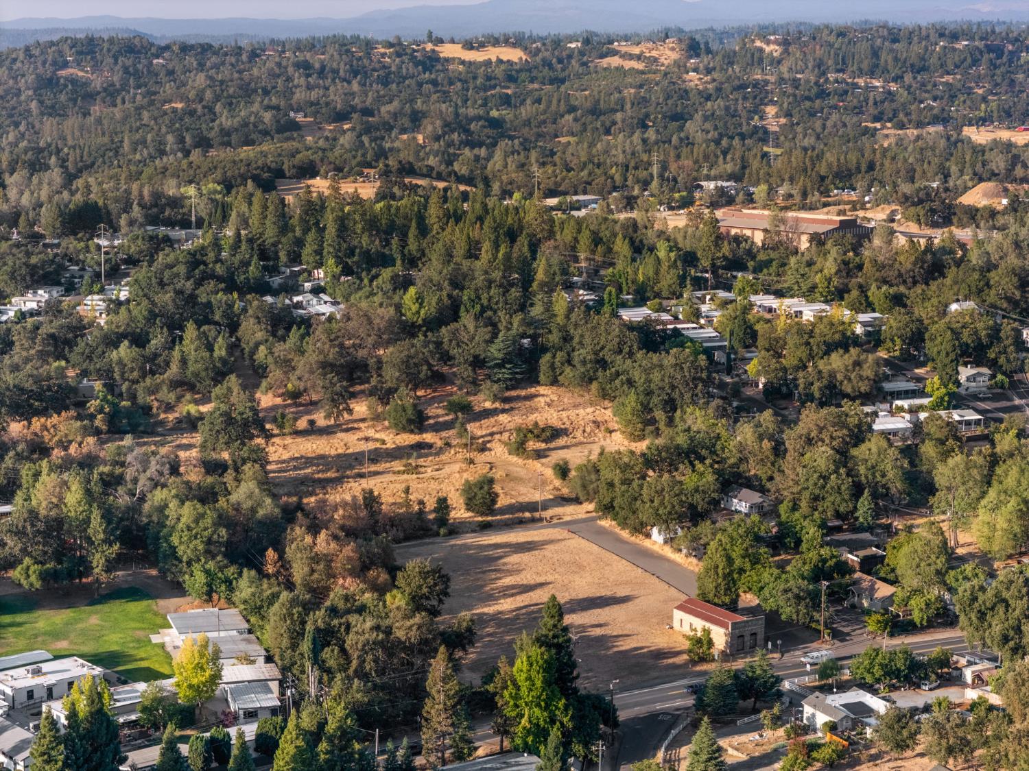 425 Pleasant Valley Road Diamond Springs, CA 95667 - Photo 19 of 19 an aerial view of residential houses with outdoor space and trees