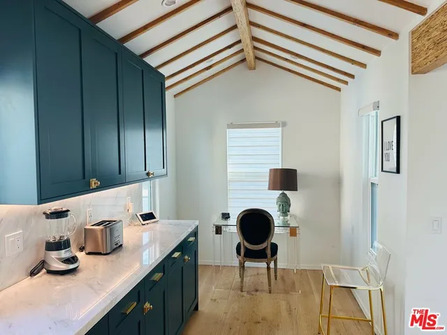 a kitchen with stainless steel appliances kitchen island granite countertop a sink and cabinets