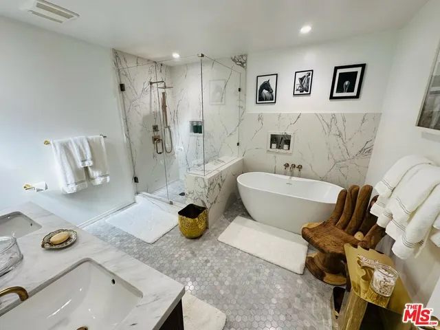 a bathroom with a sink mirror and toilet