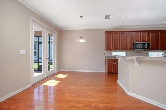 a kitchen with kitchen island a counter top space a sink and appliances