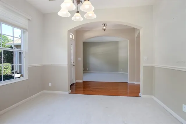 a view of kitchen with granite countertop cabinets and outdoor view