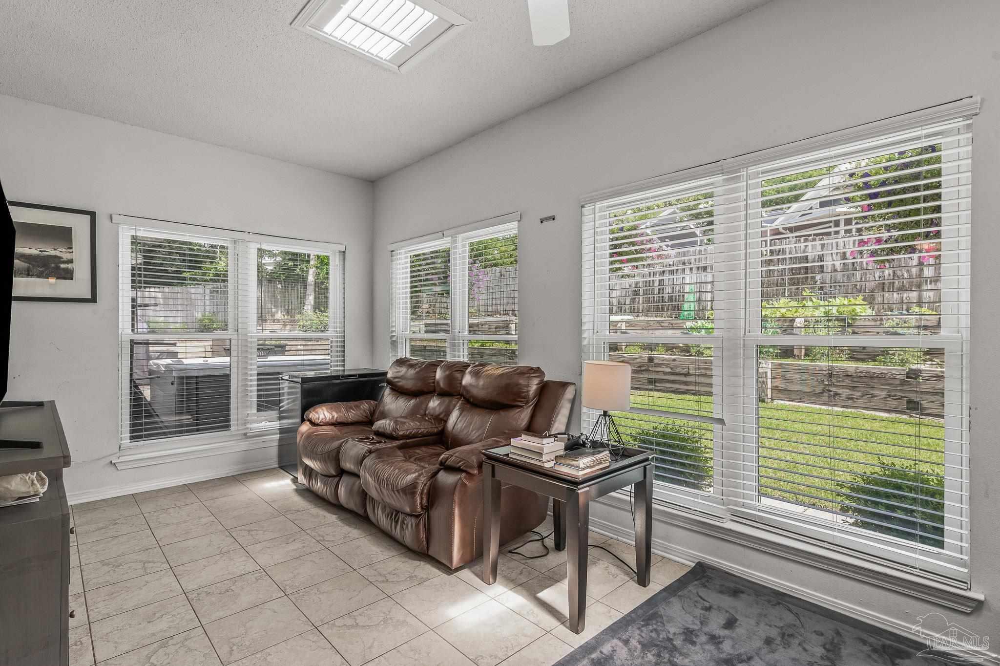 10443 Tam O Shanter Road Pensacola, FL 32514 - Photo 27 of 57 a living room with furniture and windows