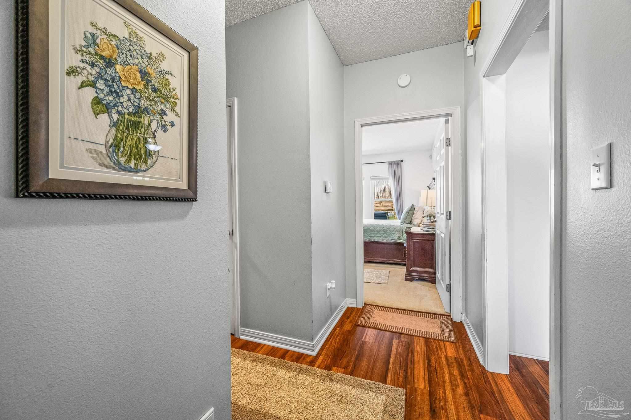 10443 Tam O Shanter Road Pensacola, FL 32514 - Photo 29 of 57 a view of a hallway view with wooden floor and living room