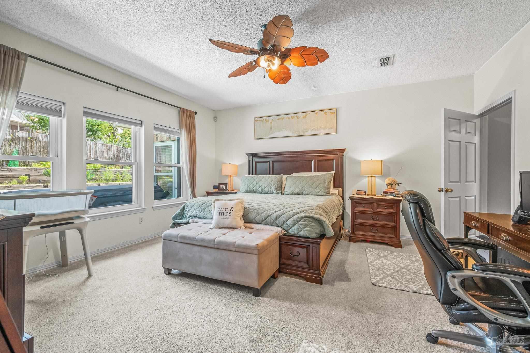 10443 Tam O Shanter Road Pensacola, FL 32514 - Photo 30 of 57 a bedroom with furniture and a window