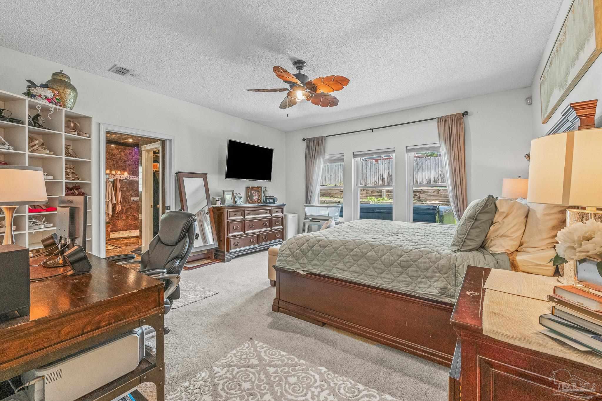 10443 Tam O Shanter Road Pensacola, FL 32514 - Photo 31 of 57 a living room with furniture and a flat screen tv