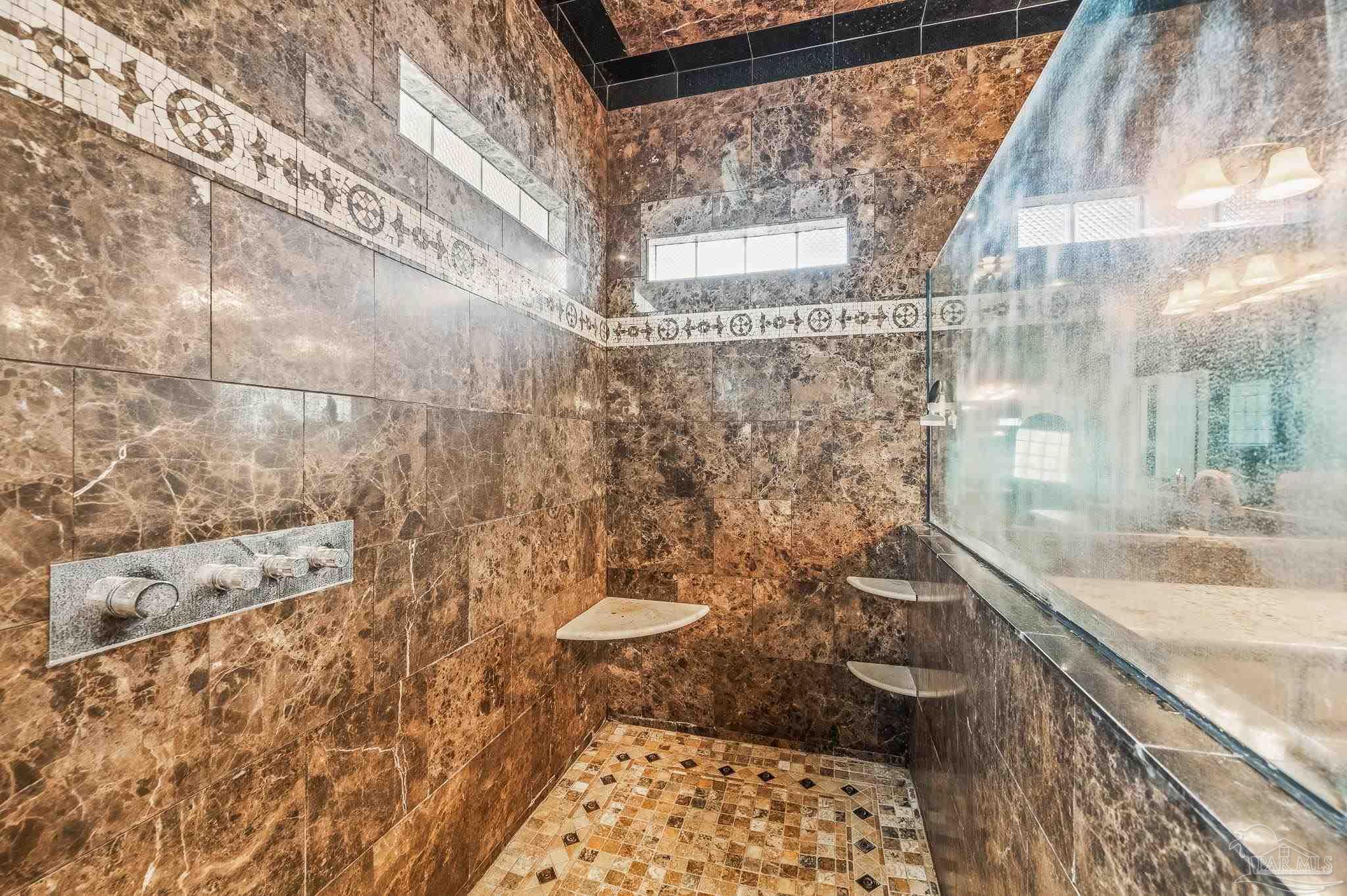 10443 Tam O Shanter Road Pensacola, FL 32514 - Photo 34 of 57 a bathroom with a sink and a shower