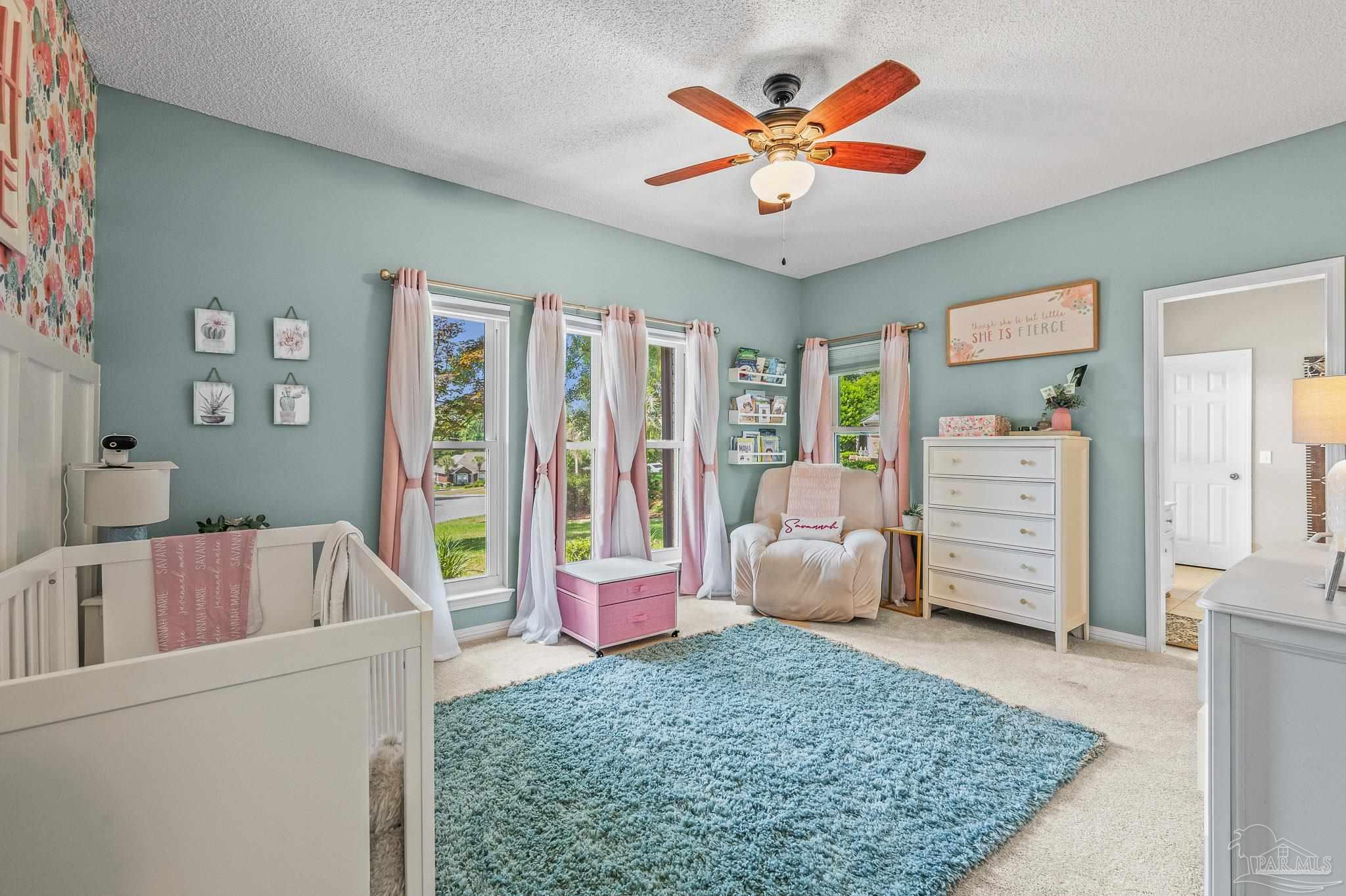 10443 Tam O Shanter Road Pensacola, FL 32514 - Photo 40 of 57 a living room with furniture and a flat screen tv