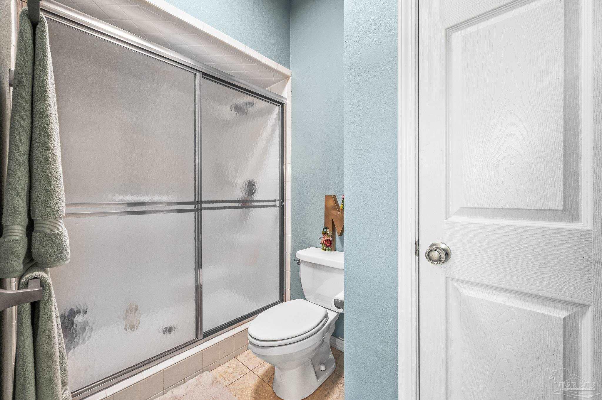 10443 Tam O Shanter Road Pensacola, FL 32514 - Photo 43 of 57 a white toilet sitting next to a shower