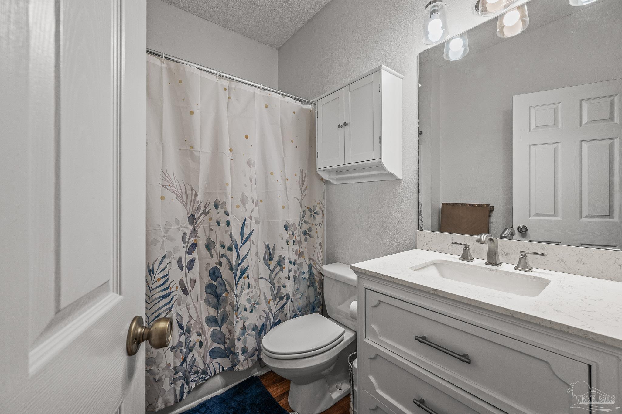 10443 Tam O Shanter Road Pensacola, FL 32514 - Photo 52 of 57 a bathroom with a sink toilet and shower