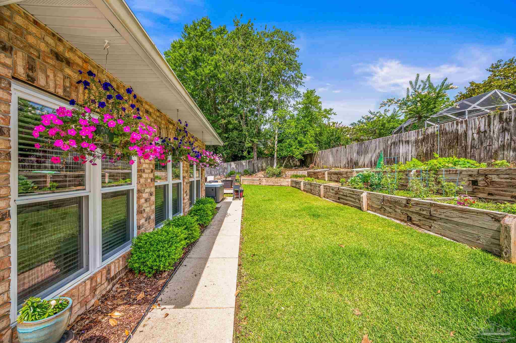 10443 Tam O Shanter Road Pensacola, FL 32514 - Photo 53 of 57 a view of a backyard with a garden