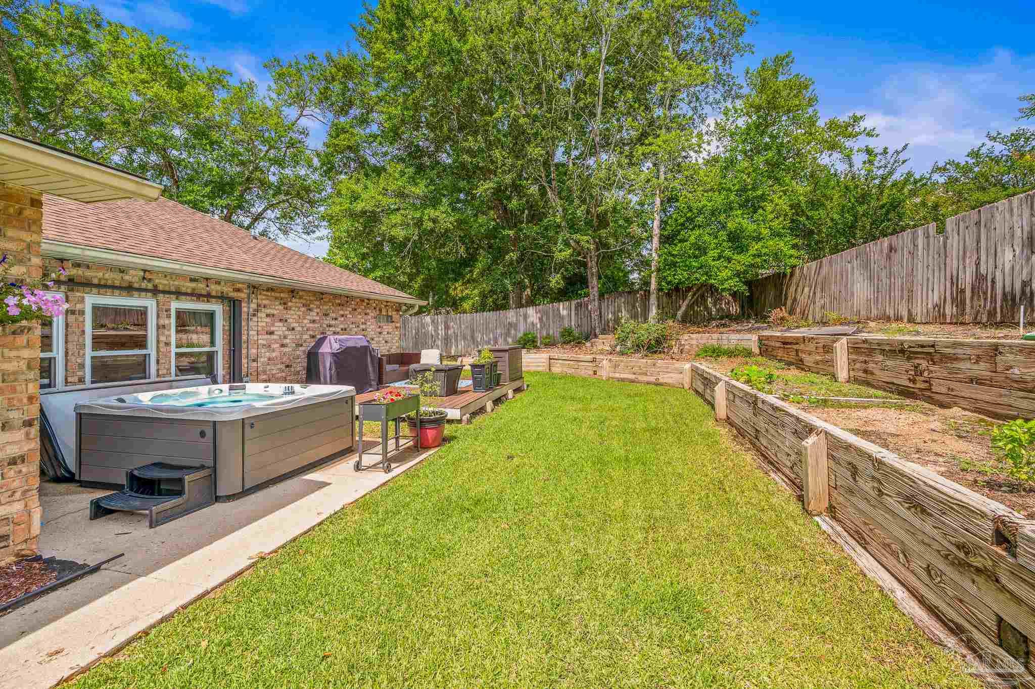 10443 Tam O Shanter Road Pensacola, FL 32514 - Photo 54 of 57 a view of a house with a backyard and a small pool
