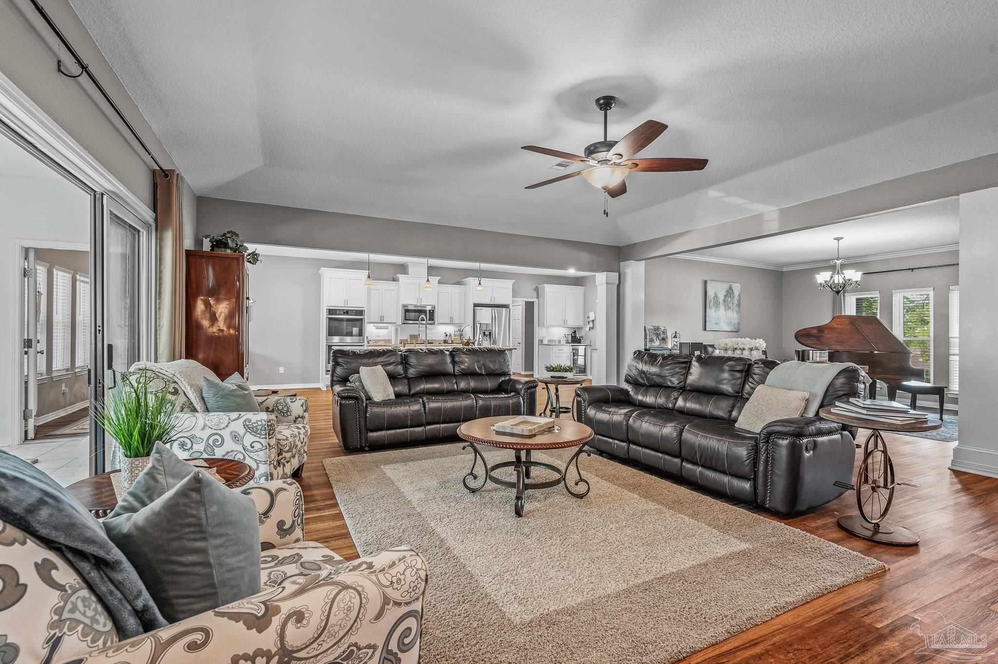 10443 Tam O Shanter Road Pensacola, FL 32514 - Photo 9 of 57 a living room with furniture ceiling fan and a rug