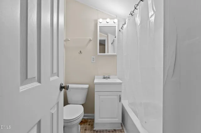 a view of wooden floor and windows in a room