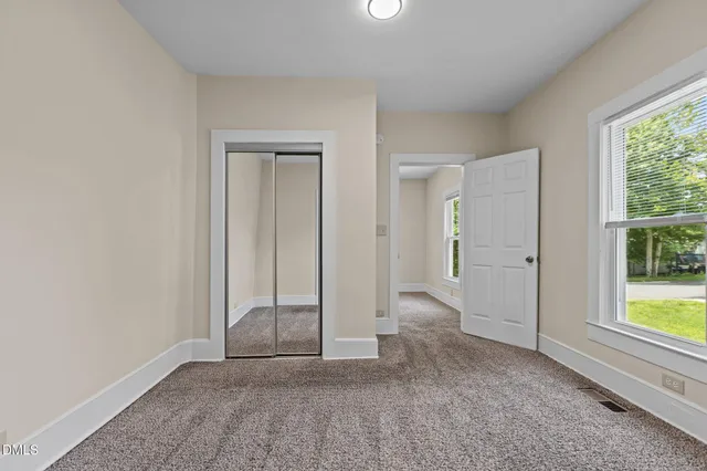 a kitchen with granite countertop cabinets and steel stainless steel appliances