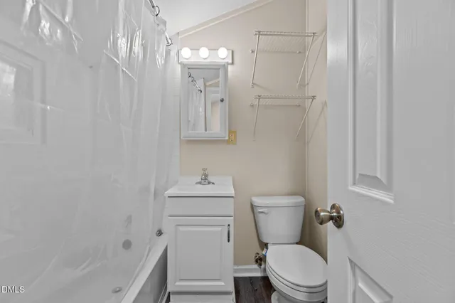 a view of a house with a yard and a garden