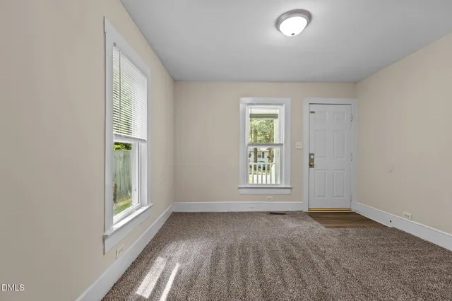 an empty room with windows