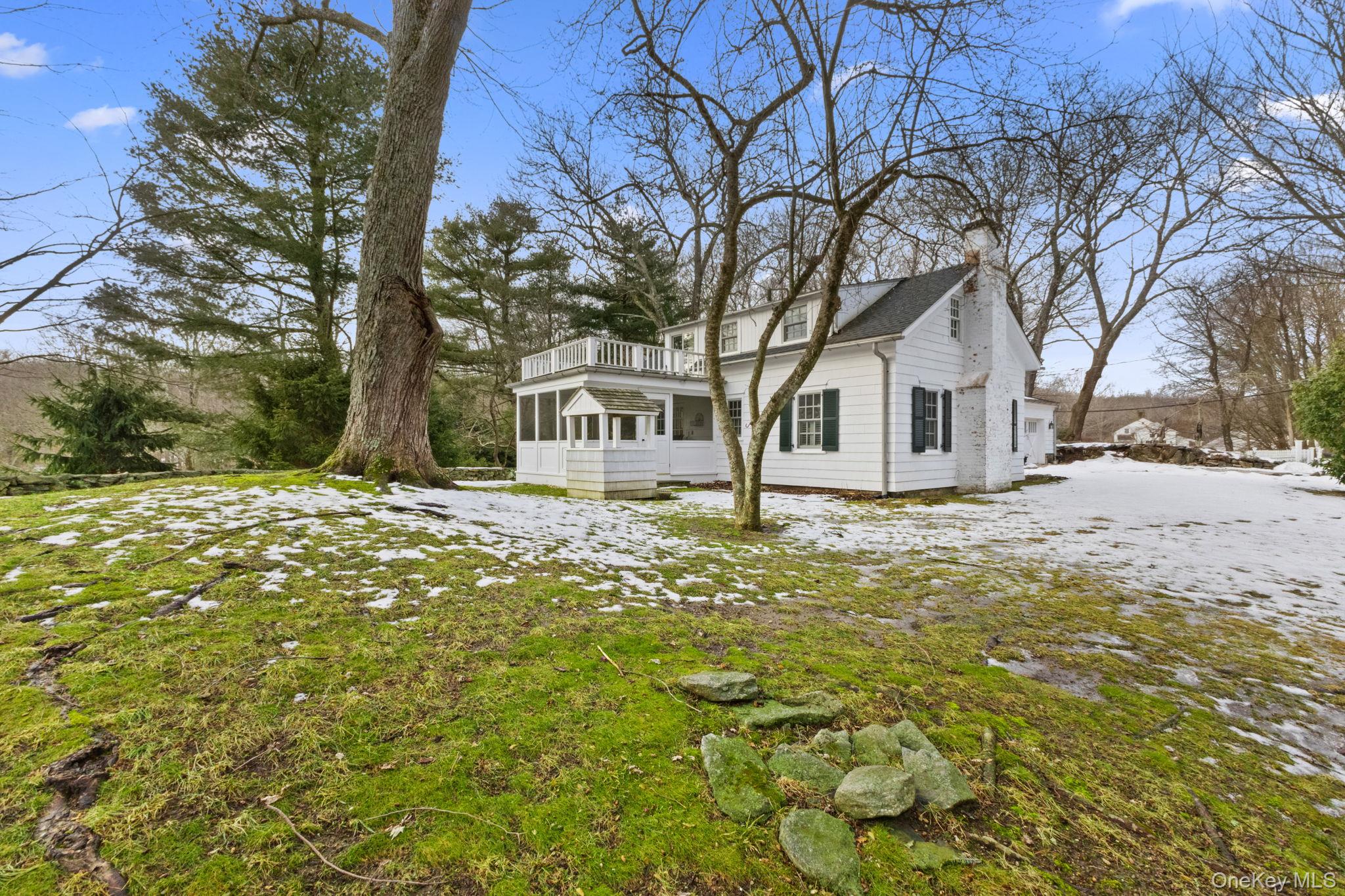 8 South Bedford Road Pound Ridge, NY 10576 - Photo 2 of 32 a large tree in front of house