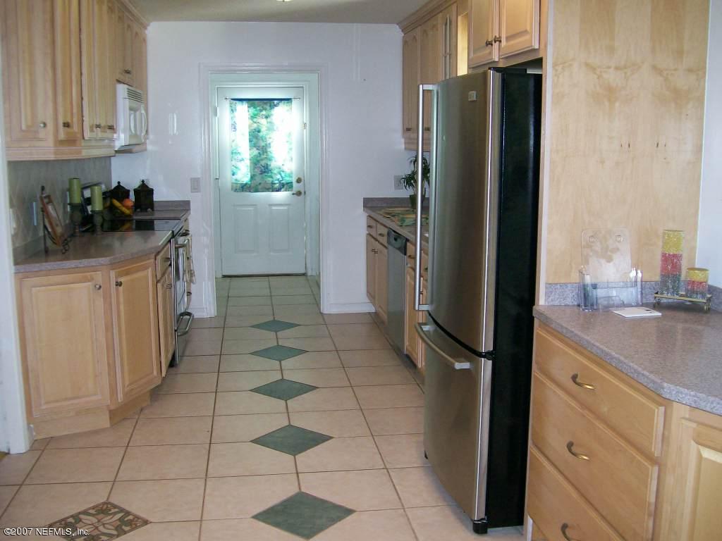 3333 Carmel Road St. Augustine, FL 32086 - Photo 2 of 12 a kitchen with a refrigerator a sink and dishwasher