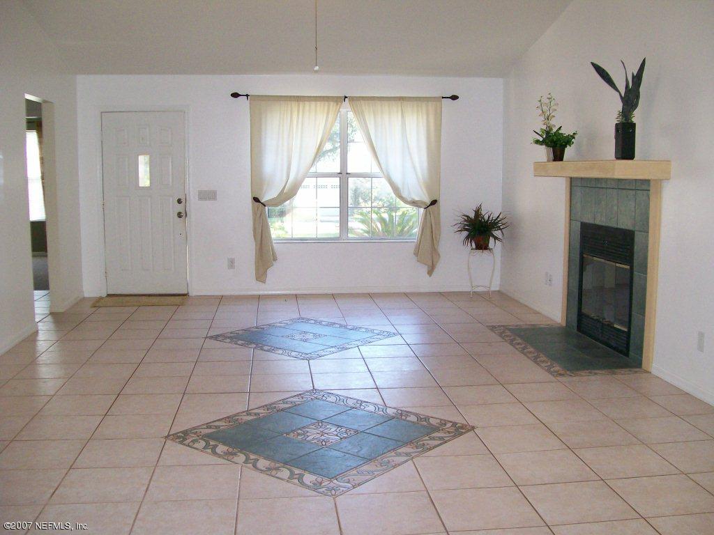 3333 Carmel Road St. Augustine, FL 32086 - Photo 3 of 12 an empty room with windows and entrance