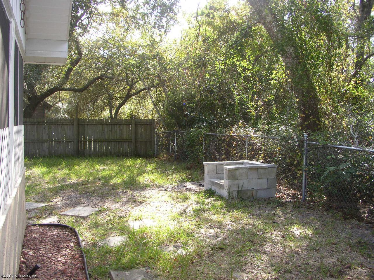 3333 Carmel Road St. Augustine, FL 32086 - Photo 6 of 12 a backyard of a house with lots of green space