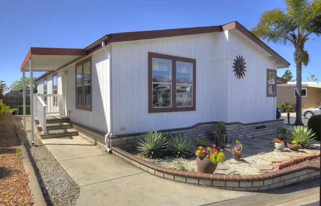 a view of a house with outdoor seating area