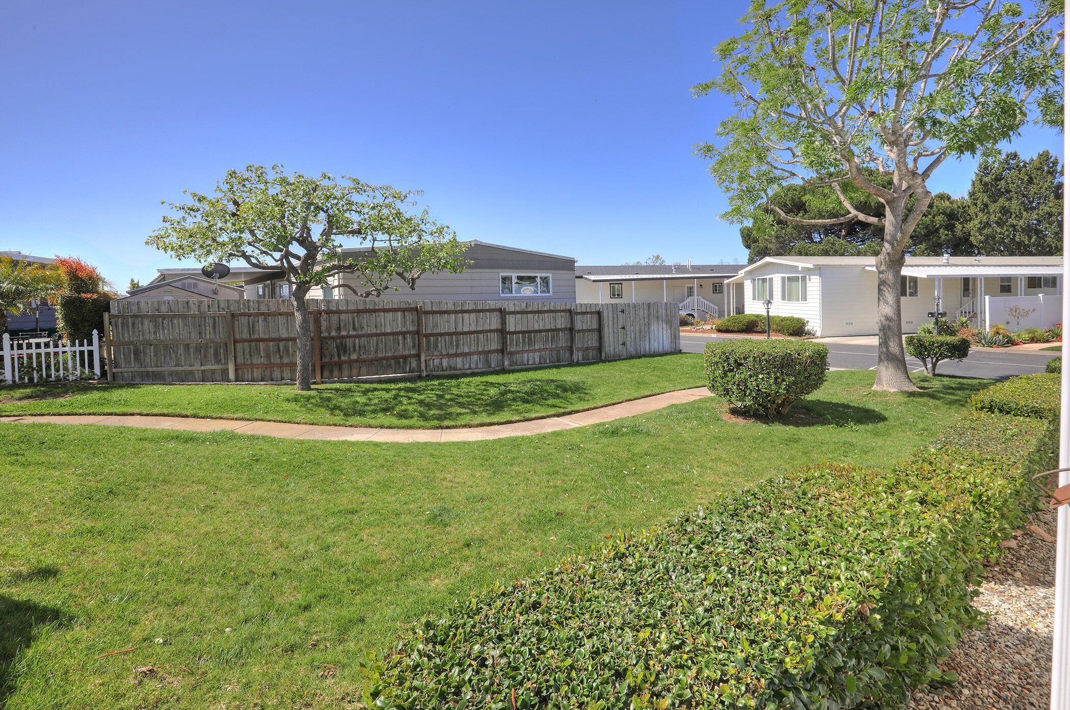 6180 Via Real, Unit 61 Carpinteria, CA 93013 - Photo 17 of 24 a view of a backyard with a garden