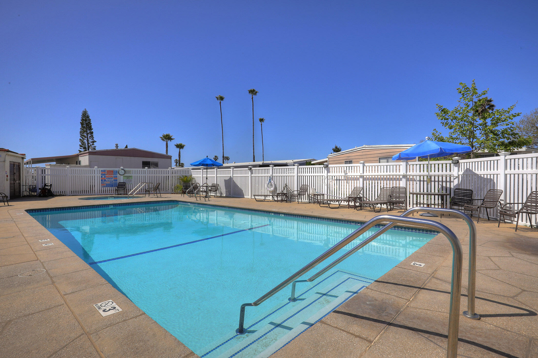 6180 Via Real, Unit 61 Carpinteria, CA 93013 - Photo 23 of 24 a kitchen with stainless steel appliances granite countertop a sink and cabinets