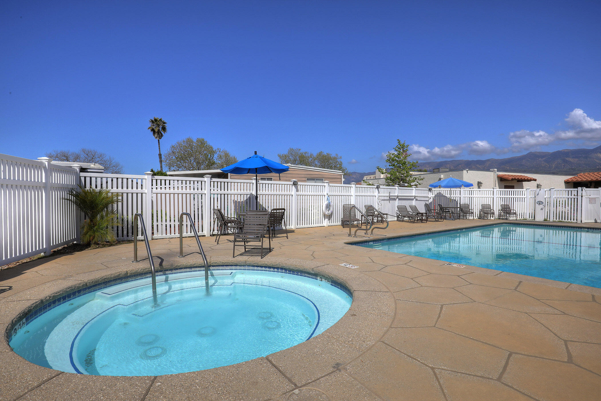 6180 Via Real, Unit 61 Carpinteria, CA 93013 - Photo 24 of 24 a view of a swimming pool with a patio and a yard