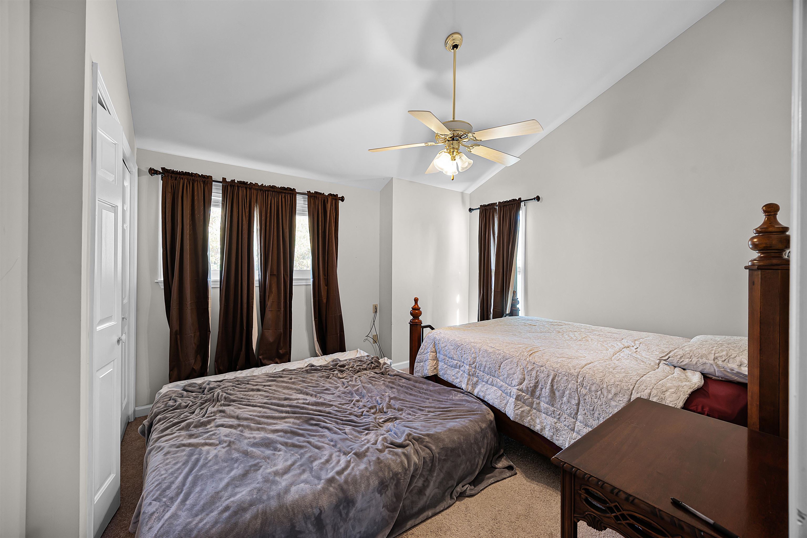80 Riviera Cove Cherokee, AL 35616 - Photo 17 of 31 Bedroom featuring carpet floors, lofted ceiling, and ceiling fan