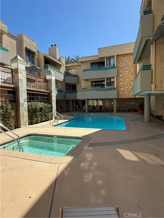 a view of a building with a swimming pool