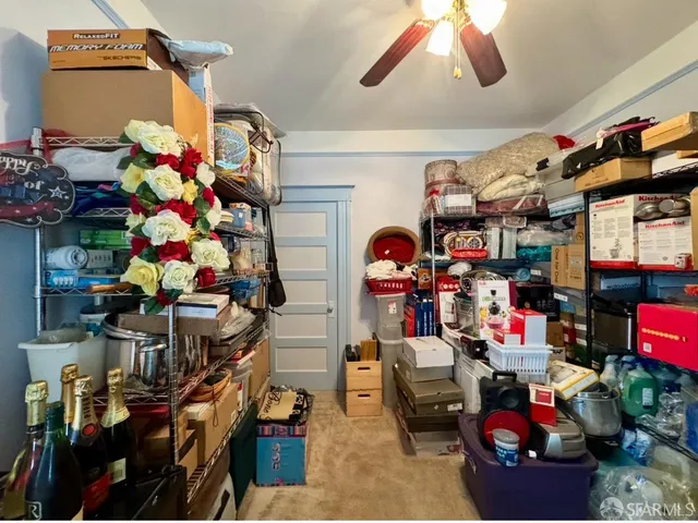 a room with lots of different colored cloths and lots of stuff