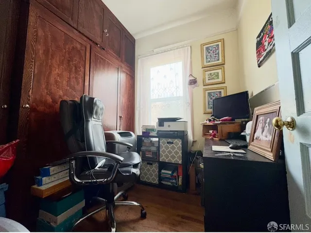 a room with a chair and gym equipment