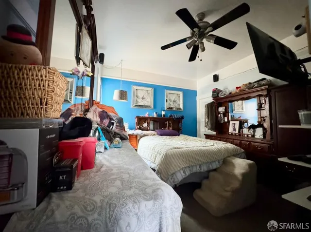 a bed room with bed and window