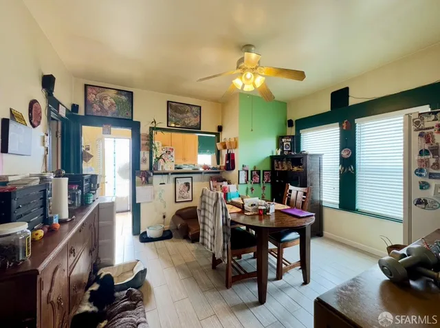 a dining room with furniture and window