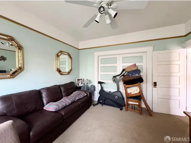 a living room with furniture and a window