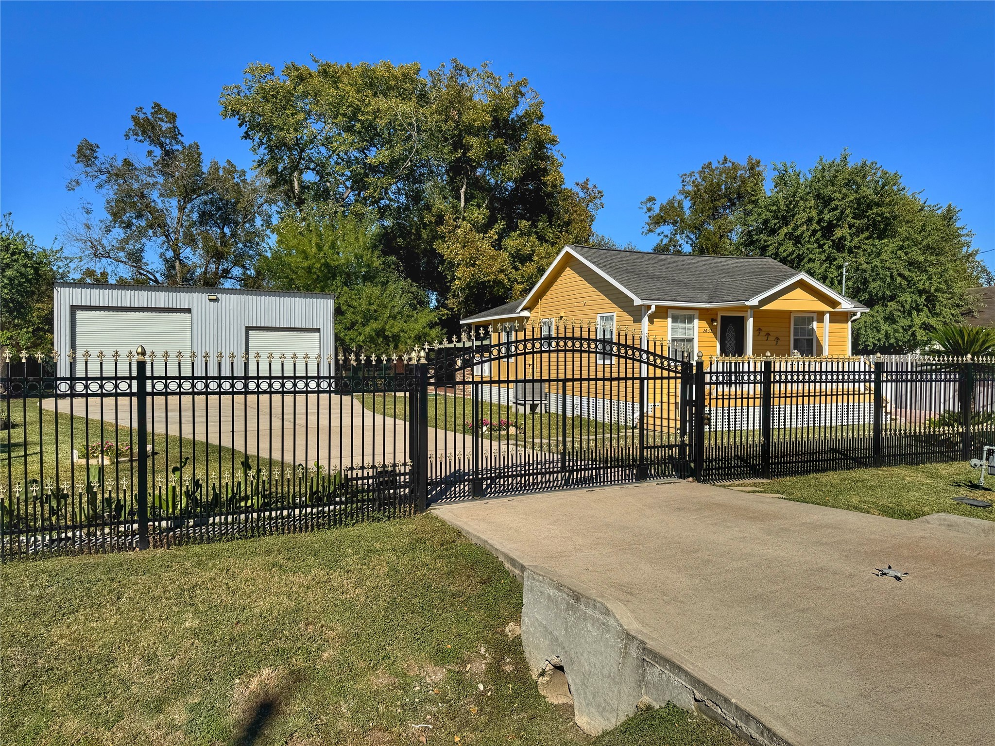 2633 Hollis Street Houston, TX 77093 - Photo 3 of 32 a view of a house with a small yard and wooden fence