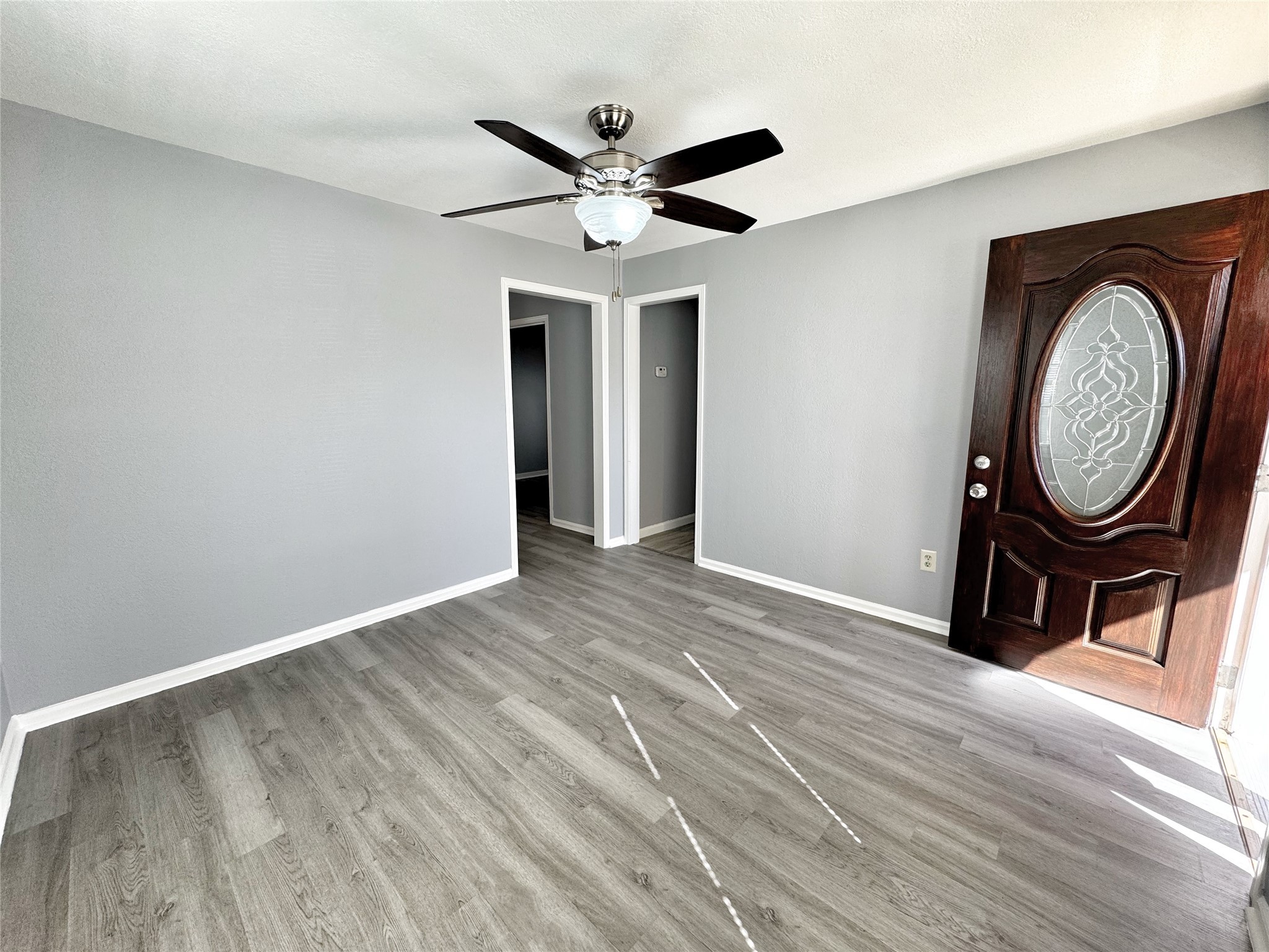 2633 Hollis Street Houston, TX 77093 - Photo 5 of 32 a view of an entryway with wooden floor