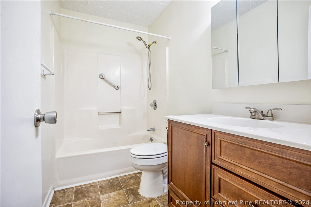 101 Dundee Lane Spring Lake, NC 28390 - Photo 18 of 32 a bathroom with a sink toilet and shower
