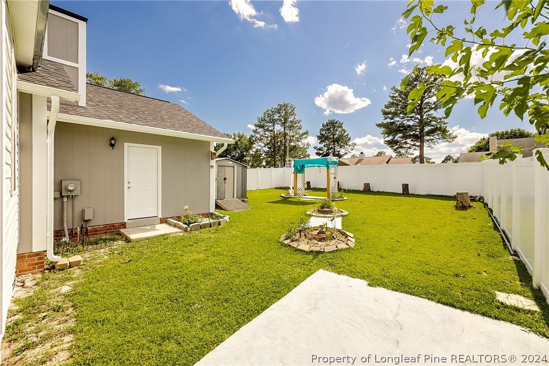 101 Dundee Lane Spring Lake, NC 28390 - Photo 2 of 32 a view of a swimming pool with a yard
