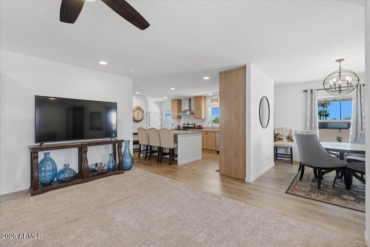 320 East McKellips Road, Unit 199 Mesa, AZ 85201 - Photo 12 of 32 a living room with furniture and a flat screen tv