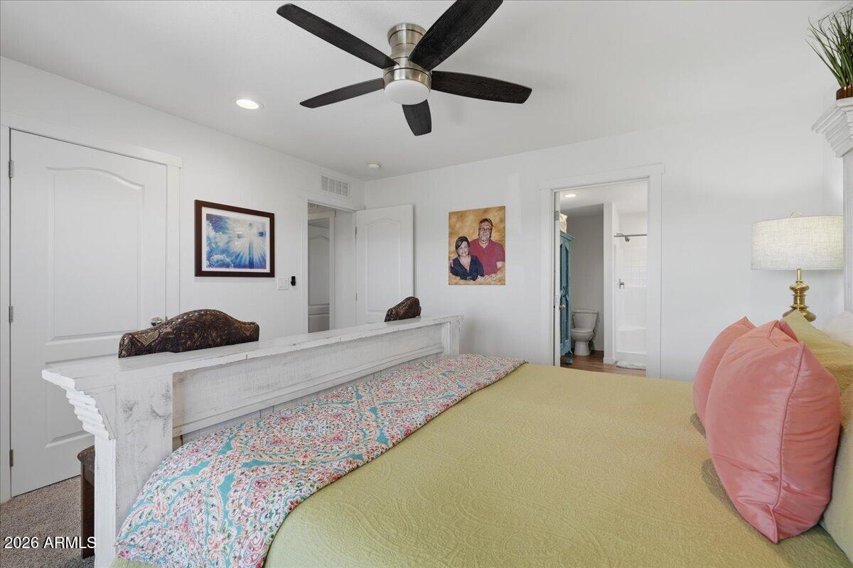 320 East McKellips Road, Unit 199 Mesa, AZ 85201 - Photo 21 of 32 a bedroom with a bed and a dresser
