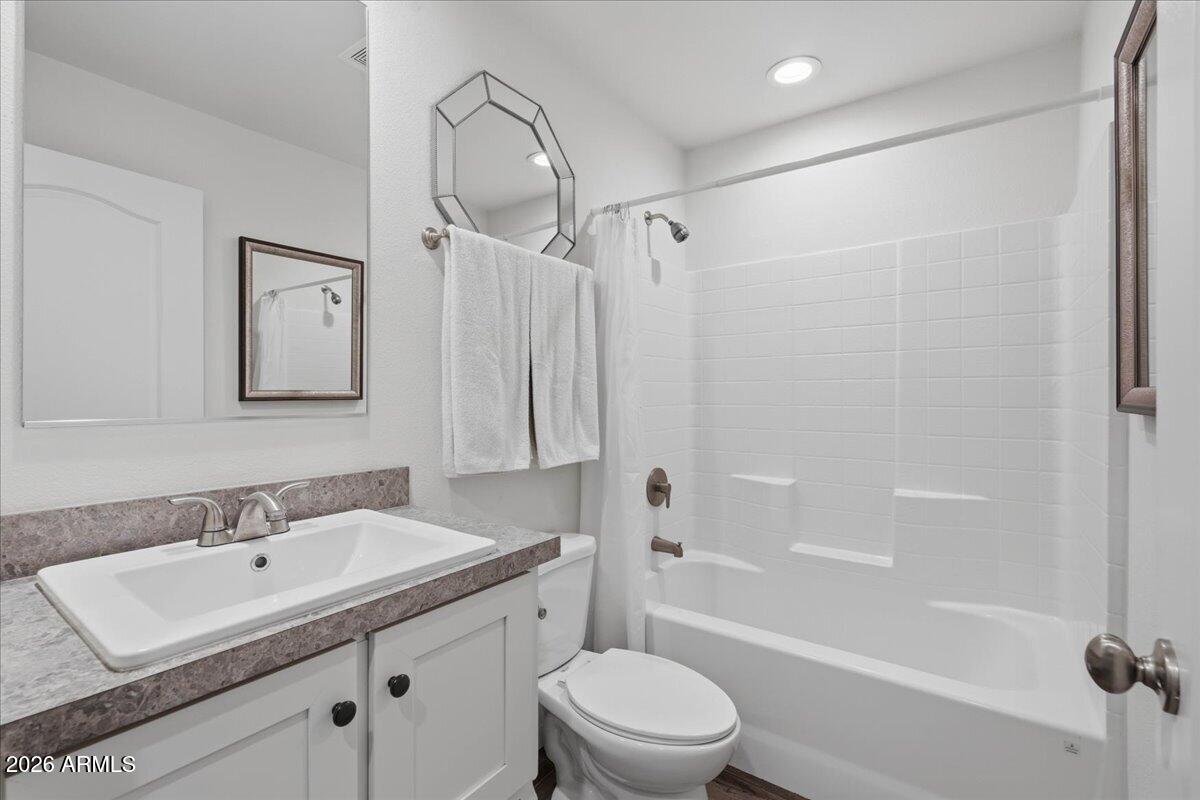 320 East McKellips Road, Unit 199 Mesa, AZ 85201 - Photo 26 of 32 a bathroom with a sink toilet tub and shower