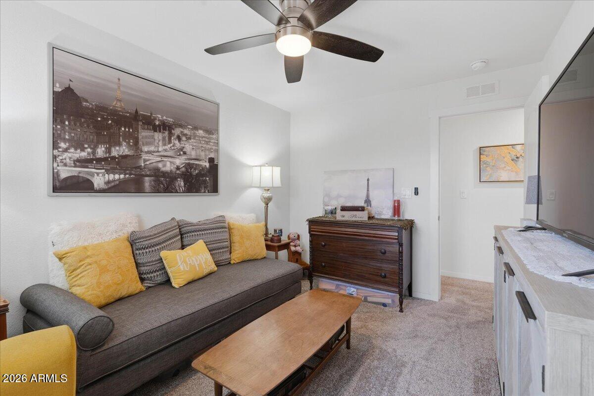 320 East McKellips Road, Unit 199 Mesa, AZ 85201 - Photo 28 of 32 a bedroom with furniture and a ceiling fan