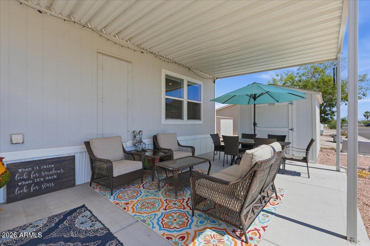 320 East McKellips Road, Unit 199 Mesa, AZ 85201 - Photo 31 of 32 a living room with furniture and a large window