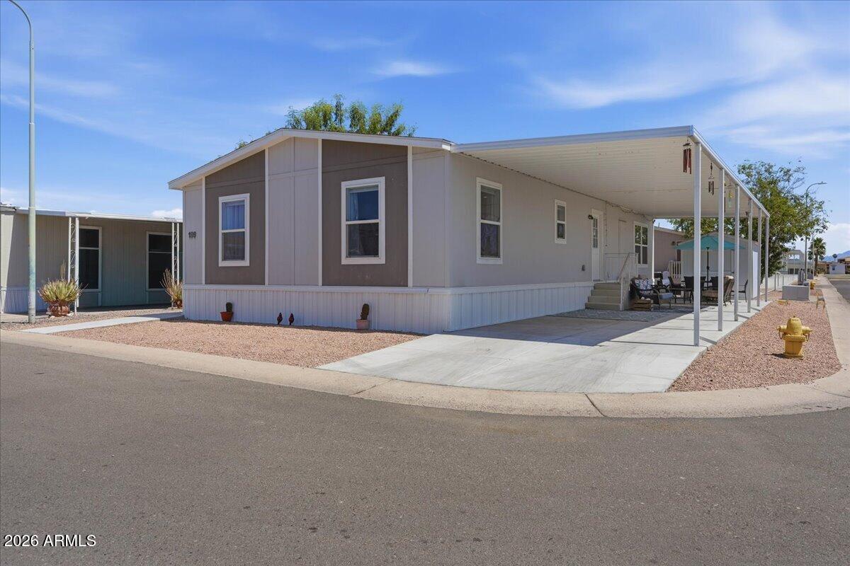 320 East McKellips Road, Unit 199 Mesa, AZ 85201 - Photo 6 of 32 a view of a house with a outdoor space