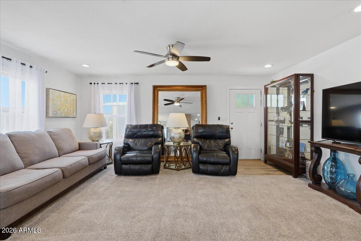 320 East McKellips Road, Unit 199 Mesa, AZ 85201 - Photo 9 of 32 a living room with furniture and a flat screen tv
