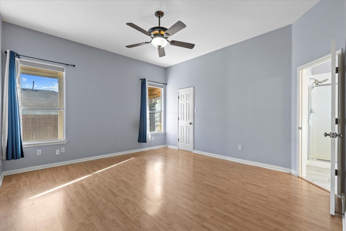 3523 Cheyenne Street Round Rock, TX 78665 - Photo 13 of 34 Empty room with light wood-style flooring and ceiling fan