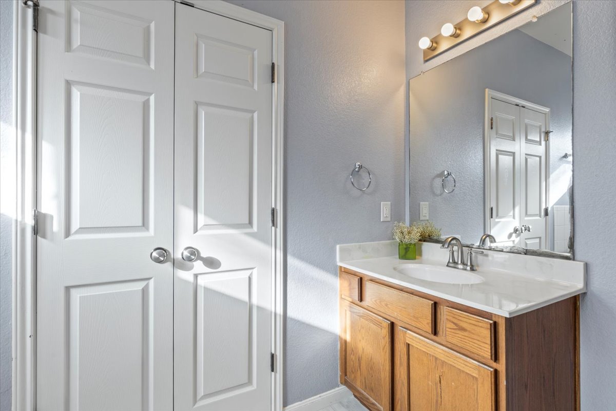 3523 Cheyenne Street Round Rock, TX 78665 - Photo 14 of 34 Bathroom with vanity and a textured wall